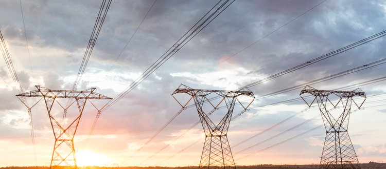 Large Power Lines Span Across the Land Keeping Electricity Prices Low