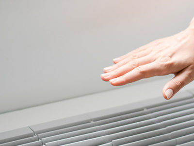 Person effectively using alternative energy to stay cool with air conditioner