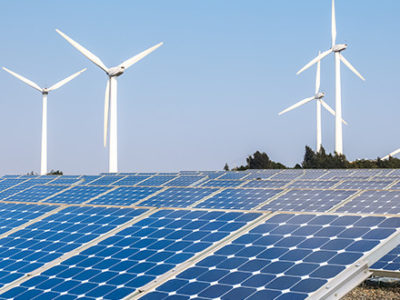 Wind Turbines and Solar Panels representing how clean energy can help the environment