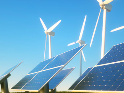 Solar and Wind Farms lined up next to each other create a beautiful and sustainable earth