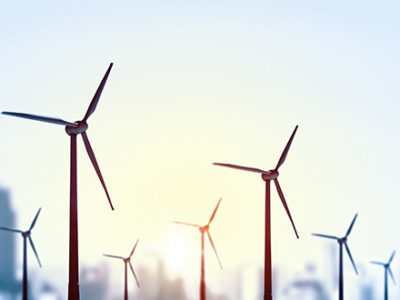 City Skyline in the background of wind turbines