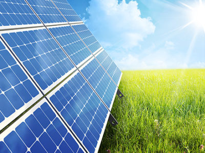 Solar Panels soaking up the sun's energy in a green field