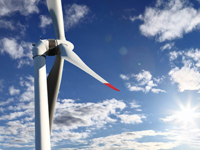 Two Large Wind Turbines on a sunny day