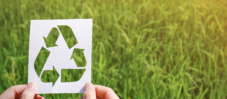 Recycle-symbol-against-grass